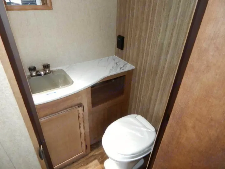 RV rental bathroom interior: includes a small sink, vanity, and toilet for convenient on-the-go travel.. Starcraft Launch 19BHS 2017