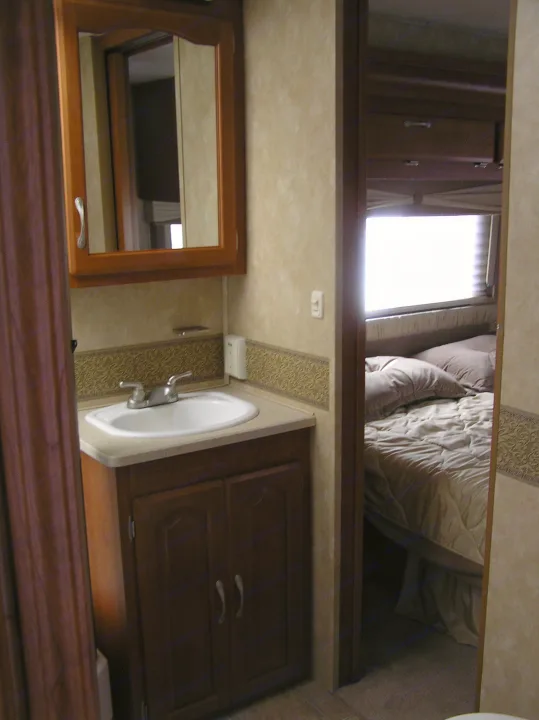 Bathroom showing door entrance from bedroom. Forest River Georgetown 2007
