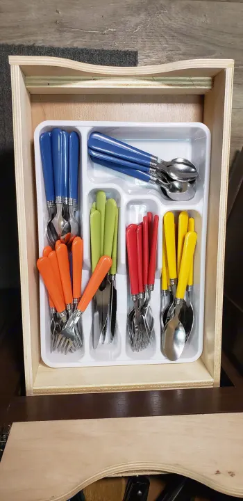 Colorful, organized cutlery in an RV rental kitchen drawer. Perfect for compact dining on your adventure!. Thor Motor Coach Freedom Elite 22 HEF 2019