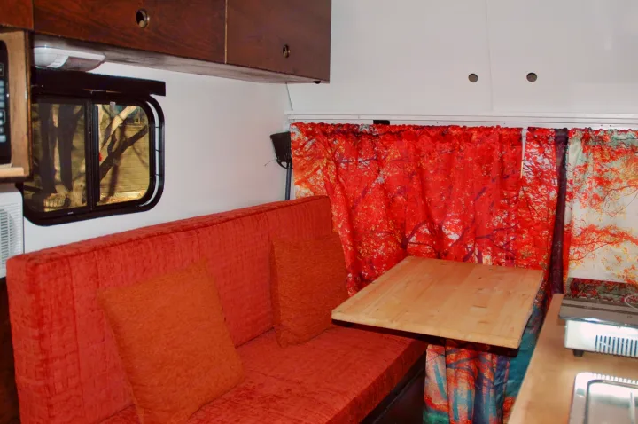The seating area has a window and upper cabinets that lock.  The sofa. can be an extra sleeping space.  . Ford E350 Box Van 2012