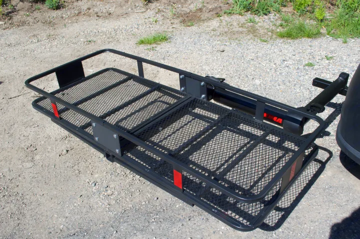 Black Yakima hitch cargo carrier for RV rental, securely expands storage. Features a sturdy mesh floor for extra gear.. Ram Promaster City 2018