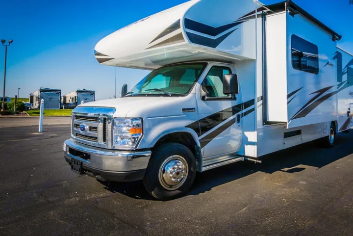 A white Ford Class C motorhome, featuring an extended slide-out, available for RV rental adventures.. Jayco Redhawk 31 XL 2019