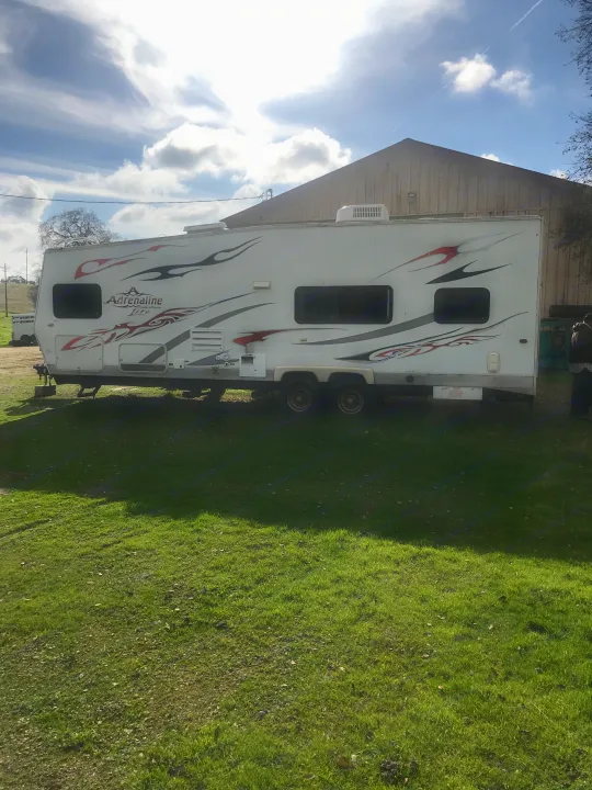 Solid Trailer with sun damaged stickers. Coachmen Adrenaline 2008