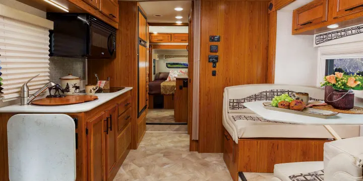 Spacious RV rental interior featuring a full kitchen, comfortable dinette, and cozy bedroom, perfect for travel.. Jayco Melbourne 2017