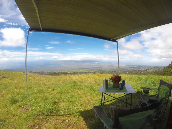 Scenic RV rental setup: Awning, table, chairs, and stunning views for outdoor relaxation. Perfect camping adventure!. Volkswagen Westfalia 2001