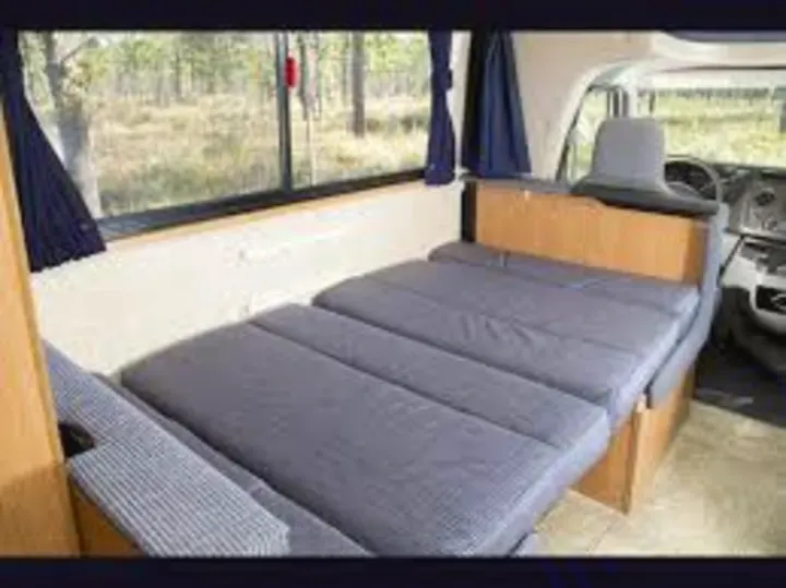 The booth dinette folds down into a small bed for the kids or a smaller grownup. Look at all the natural light!. Thor Motor Coach Four Winds Majestic 2012