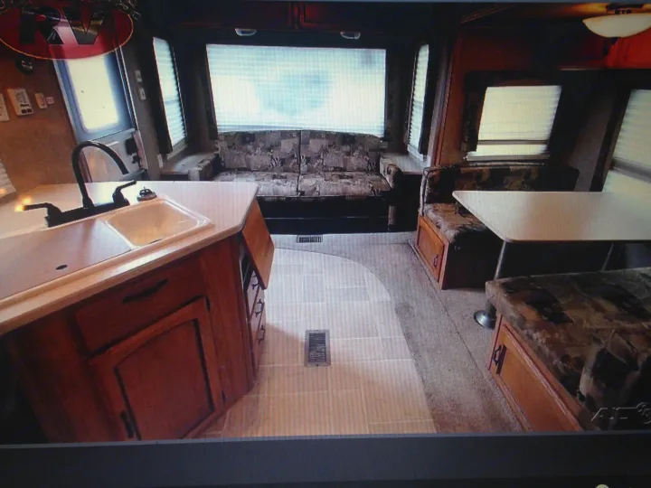 Spacious RV interior with kitchen, sofa, and dinette areas, ideal for an rv rental getaway.. Palomino Puma 2010