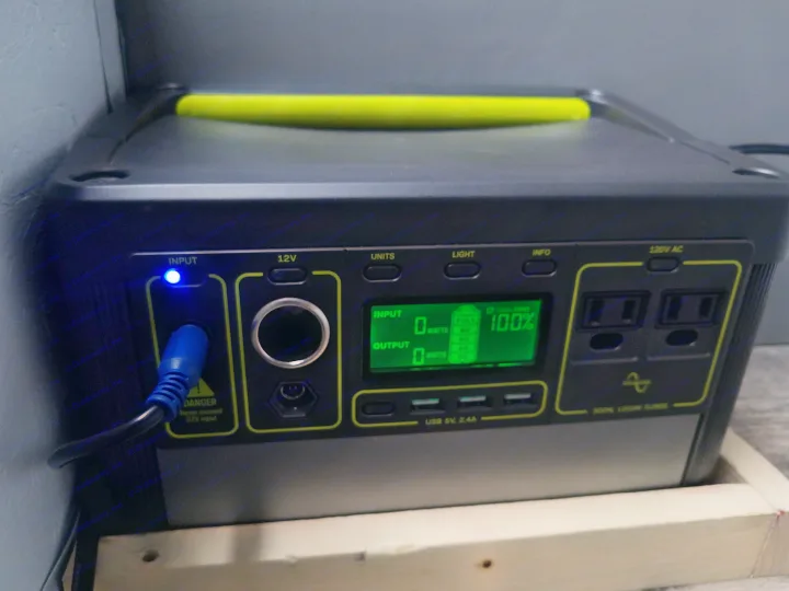 A Goal Zero Yeti portable power station, fully charged at 100%, is seen, ideal for powering electronics in an RV rental.. Ford Transit Custom 2017