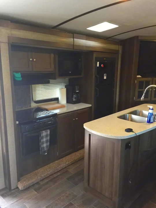 Kitchen stocked with dishware, coffee maker, toaster, gas stove/oven, microwave and fridge/freezer.. Keystone Bullet Premier 2017