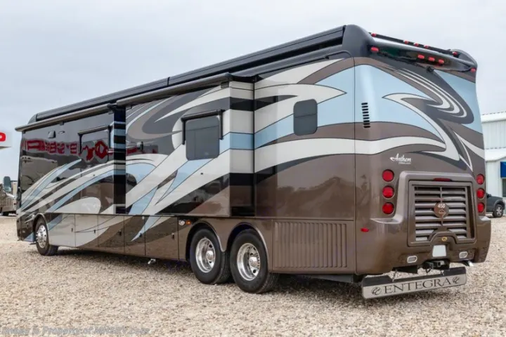 Spacious brown, black, and blue luxury motorhome parked on gravel, perfect for your next RV rental adventure.. Entegra Coach Anthem 44dlq 2016