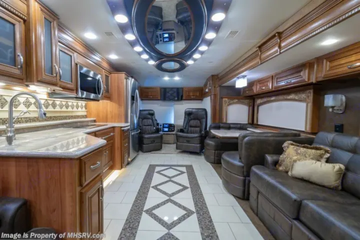 Spacious luxury RV interior with full kitchen, living area, and elegant decor, perfect for your next rv rental.. Entegra Coach Anthem 44dlq 2016