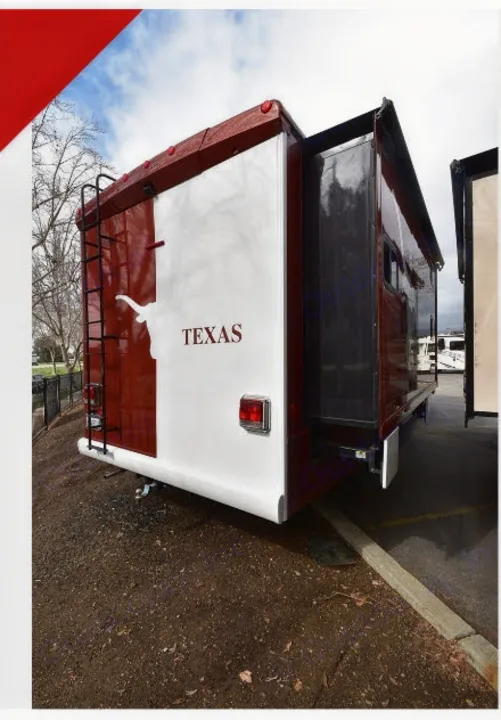 Red and white Texas-themed RV rental with longhorn logo and extended slide-out. Ready for adventure!. Winnebago Vista 2013