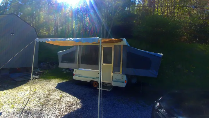 Awning set up front view. Fleetwood Newport 1991