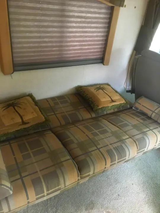 The sofa deployed to make a double bed for additional sleeping.. R-Vision Trail-Lite 25 2005