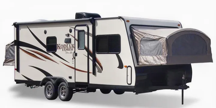 This white Kodiak Express travel trailer, with two pop-out tent sections and black/brown graphics, is ideal for your next rv rental adventure.. Dutchmen Kodiak 2016