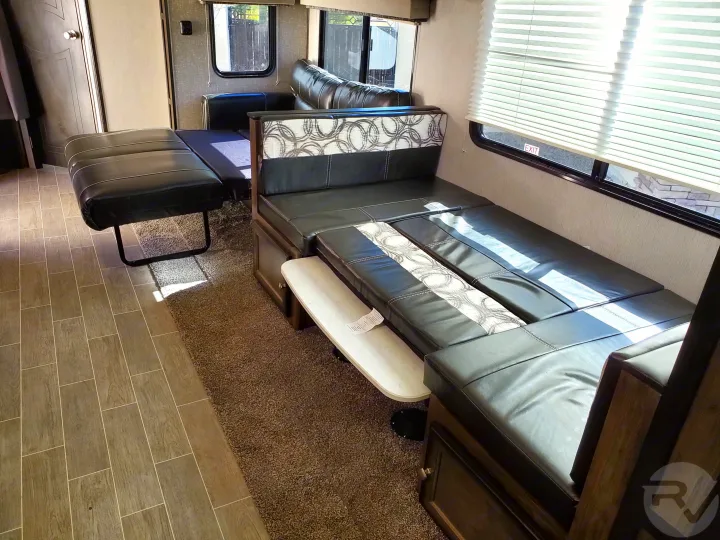 RV rental interior: convertible dinette and sofa-bed offer flexible living & sleeping space in this comfortable RV.. Heartland Wilderness 2020