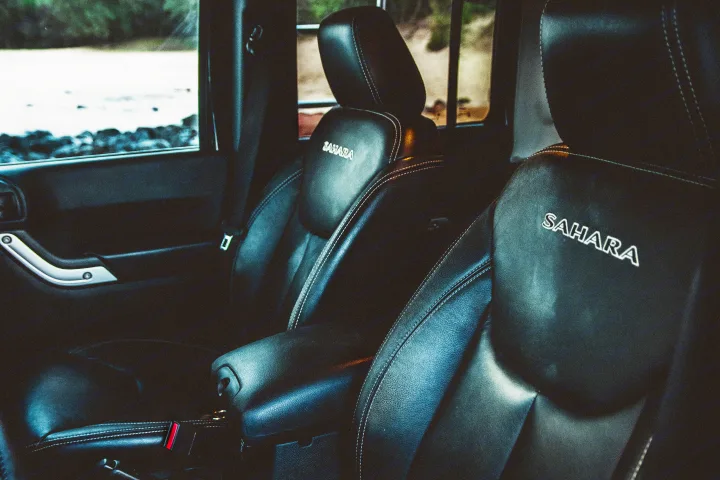 Jeep Sahara's comfortable black leather interior, ideal for your next rv rental adventure by the sea.. Jeep Wrangler Unlimited 2016