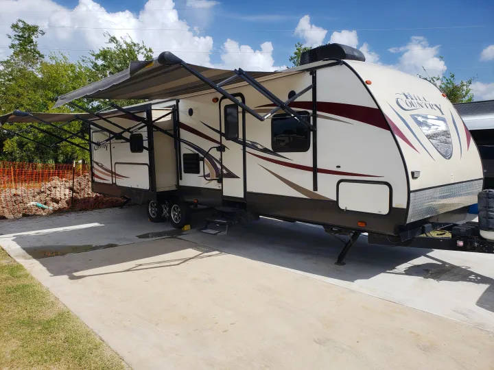 Outside view of camper set up at a local RV Park. Crossroads Hill Country 2015