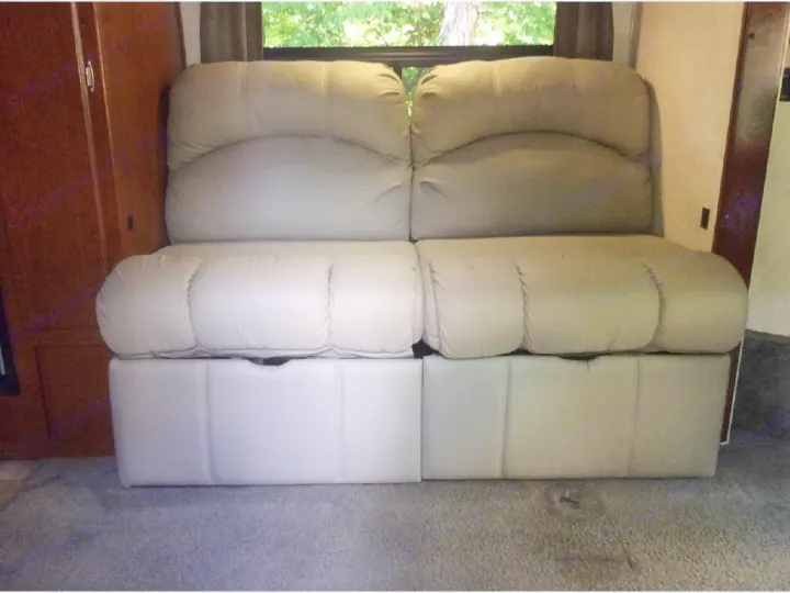 RV rental: Light-toned convertible RV sofa/bed. Plush seating and sleeping area in a modern RV interior.. Phoenix USA Cruiser 2552 2011