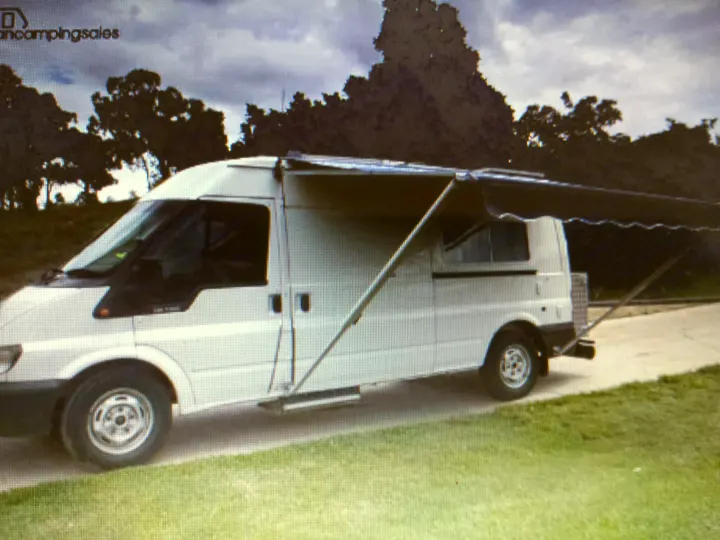 Side awning extended. Can see the electric step for sliding door.. Ford Transit Custom 2006