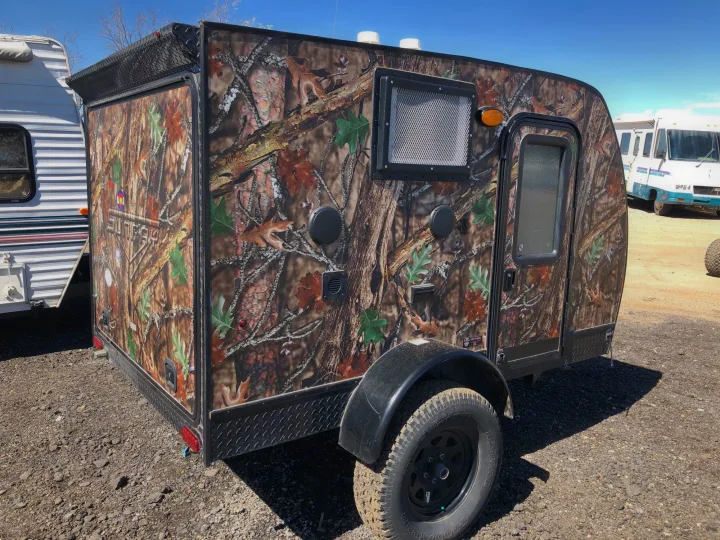 This camouflaged off-road teardrop camper is ready for adventure, available for RV rental.. Sunset Park & Rv Inc. Other 2017