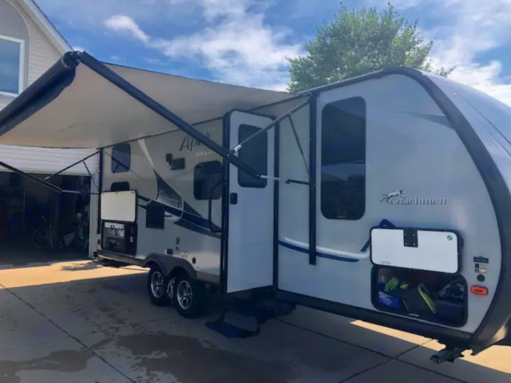 Outside, rear camp kitchen, Power Awning, storage. Coachmen Apex 2017