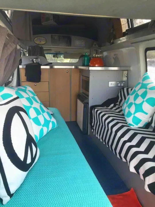 These 2 lounges make up your cozy bed. Sheepskin underlay included for added comfort. . Toyota HIACE 4 BERTH CAMPER 2005