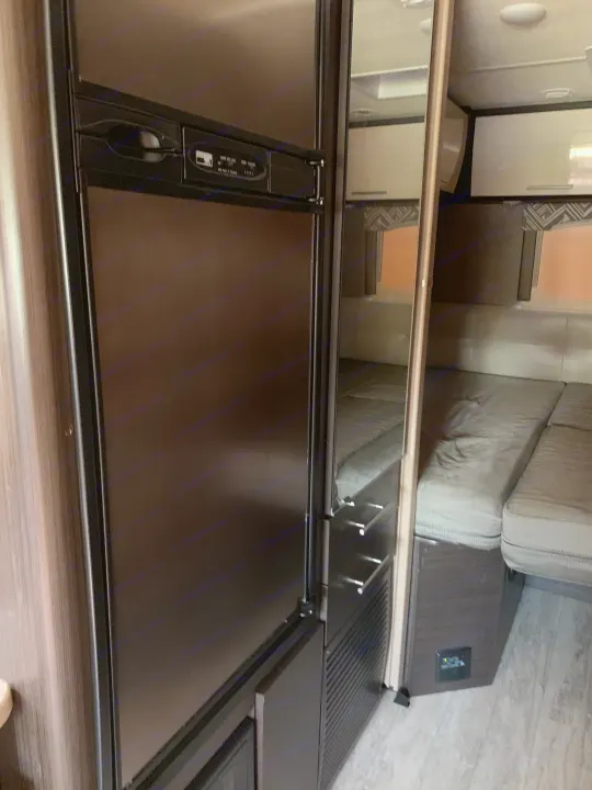 Refrigerator. Dresser mirror and bedroom. . Thor Motor Coach Axis 2018