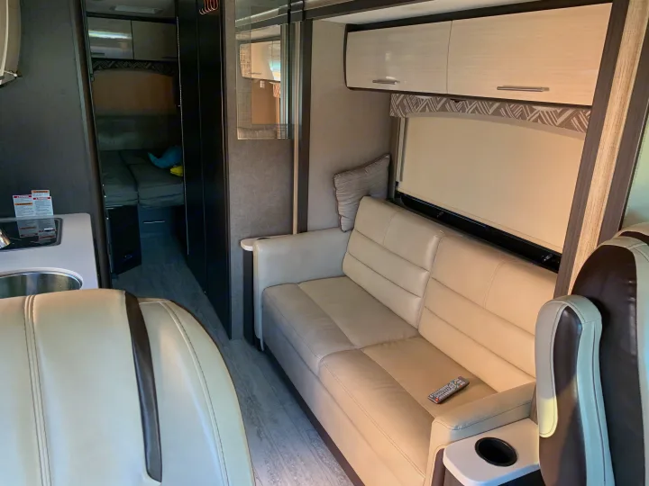 Sofa convert to queen bed when extended and kitchen area. . Thor Motor Coach Axis 2018