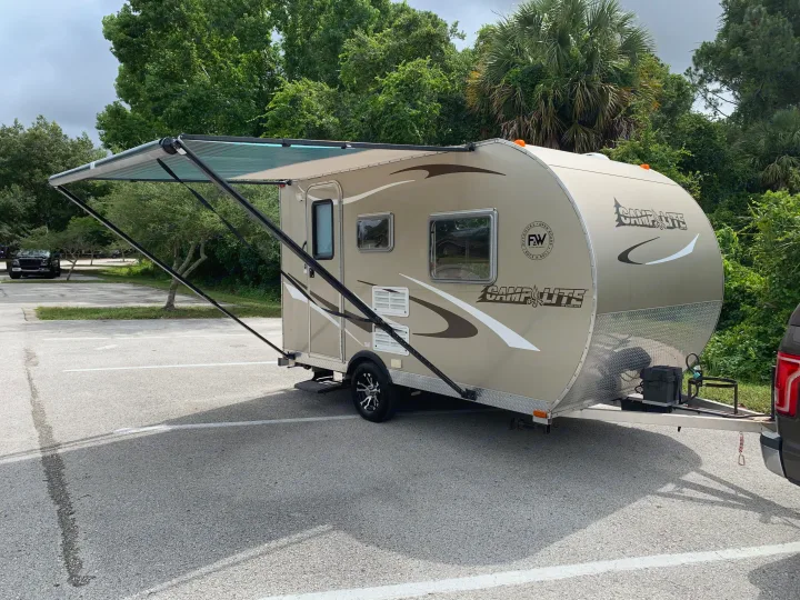 8’ manual awning provides shade and protection from light rains.. Livin' Lite Camplite 2013
