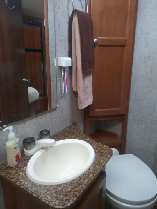 Full Bathroom with plenty of storage. Coachmen Leprechaun 2018