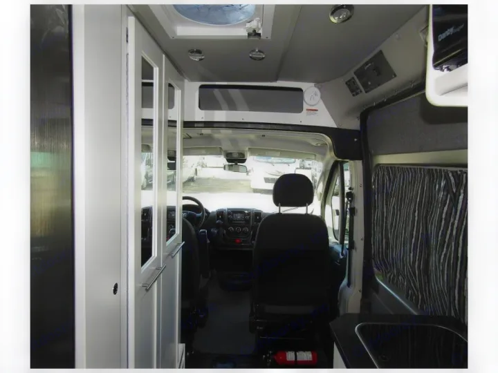 Additional storage overhead. Control panel for 200W solar and 400W lithium batteries.. Roadtrek Zion SRT 2019