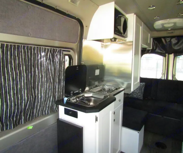 In the galley, find a pop-in table to enjoy a card game or a nice meal. In the kitchen, you'll be able to prepare a delicious meal on your 2-burner propane stove or microwave.. Roadtrek Zion SRT 2019
