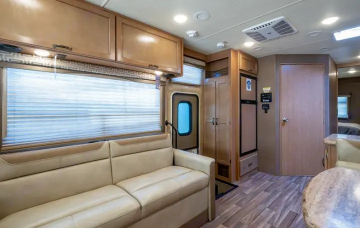 Jack-Knife sofa.  This has 2 seat belts and also turns into a bed. Thor Motor Coach A.C.E 2017