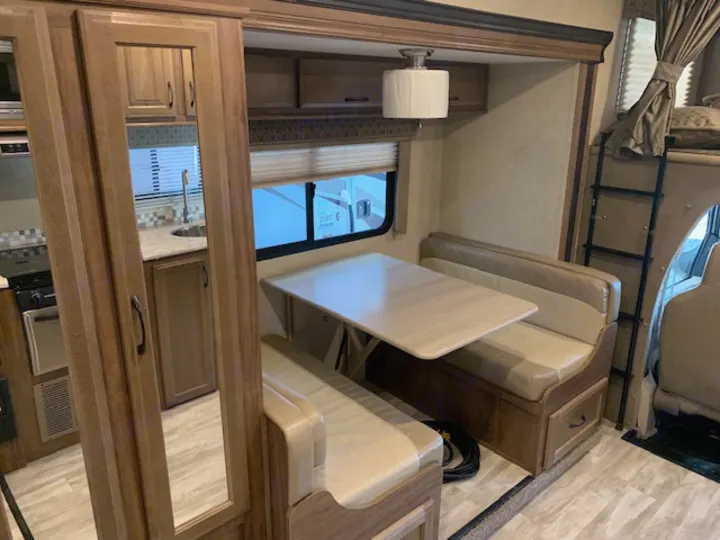 Dinette collapses to make a bed for little ones. Gulf Stream Conquest 2019
