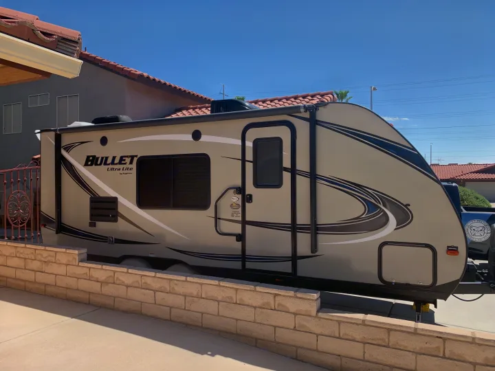 Exterior with electric awning and outdoor speakers . Keystone Bullet 2017