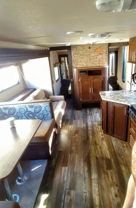 Facing forward with the sofa sleeper on the left that is easy to pull in and out and will accommodate two or three smaller people. Forest River Cherokee Grey Wolf 2015