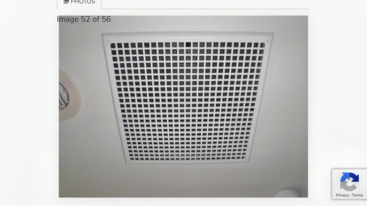 White square ceiling vent with a grid pattern and part of a round light on an RV rental ceiling.. Winnebago Outlook 2019