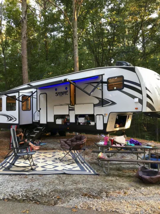 Outside area with huge motorized retractable awning. . Forest River Sabre 2018