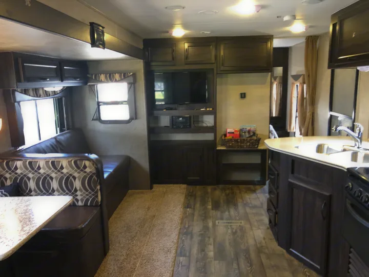 Spacious RV rental interior featuring a cozy living area, modern kitchen, and comfortable dinette for your next adventure.. Pacific Coachworks Panther BHSS 2019