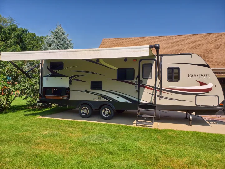 18 foot power awning with multicolor lights makes for great protection from sun. Keystone Passport Grand Touring 2670BH 2016