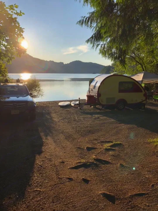 Enjoying a scenic sunset by the lake, our RV rental, SUV, and paddleboards ready for adventure at this perfect campsite.. T@B Q Floorplan Maxx Package 2016