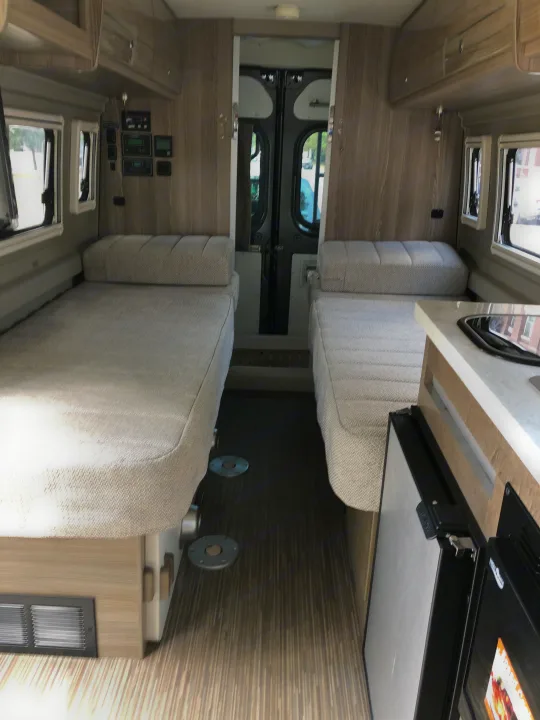 From the cockpit looking towards the rear.  The bed on the left (passenger side) is 30"x 80".   The bed on the right (driver's side) is 30" x 74".. Winnebago Other 2019