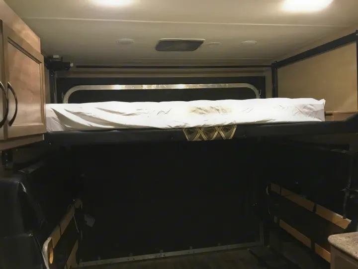 Upper queen bed rear of camper . Pacific Coachworks Sandsport 2017