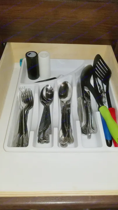 Neatly organized cutlery and kitchen utensils in a drawer, showcasing RV rental essentials like forks, spoons, and shakers.. Jayco Jay Flight 2018