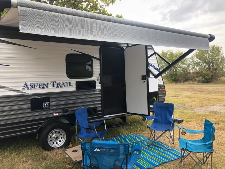 Relax under the power awning with included chairs (4) and side table (1).  RV mat included as well.. Dutchmen Aspen Trail 2019