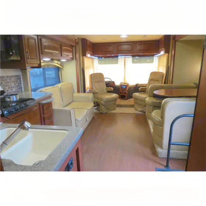 Spacious RV rental interior with kitchen, living area, dinette, and cockpit. Perfect for travel adventures in a comfortable motorhome.. Jayco Precept 2014