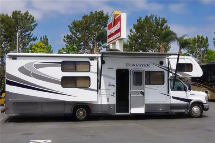 White Forester Class C RV rental with its slide-out extended and door open, ready for adventure.. Forest-River Forester 2017