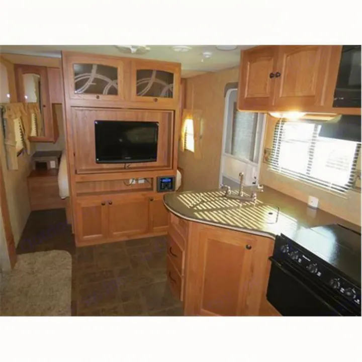 Spacious RV rental interior featuring a full kitchen with sink/stove & entertainment center. Comfortable travel.. North-Trail Heartland 2011