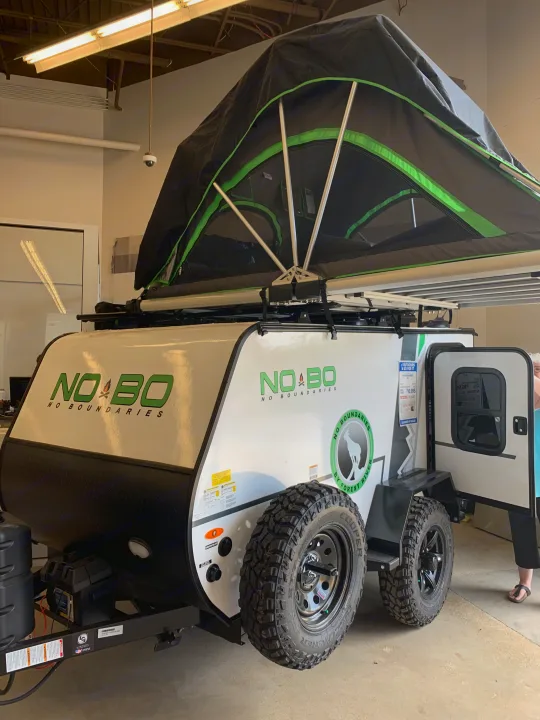 Exterior driver side with tent set up for sleeping. Forest River Other 2020